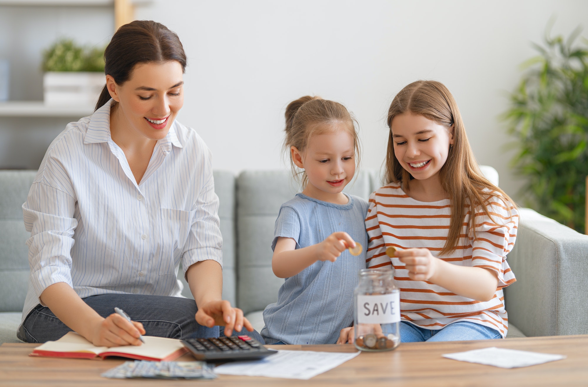 women calculating family budget